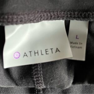 Size L Athleta leggings with faux leather on sides